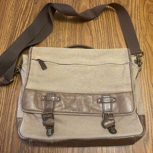 Eddie Bauer canvas message bag with leather trimming. Brushed bronze hardware.